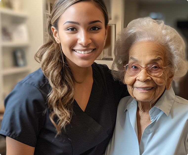A carer and an older woman sharing a smile